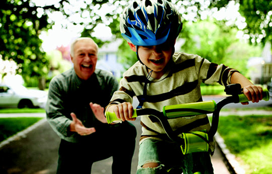 grandpa and boy on bike