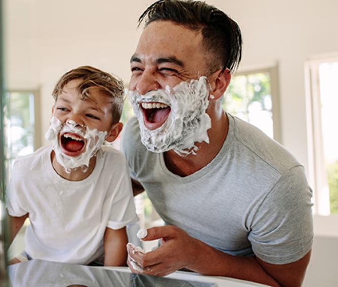 Dad and son shaving